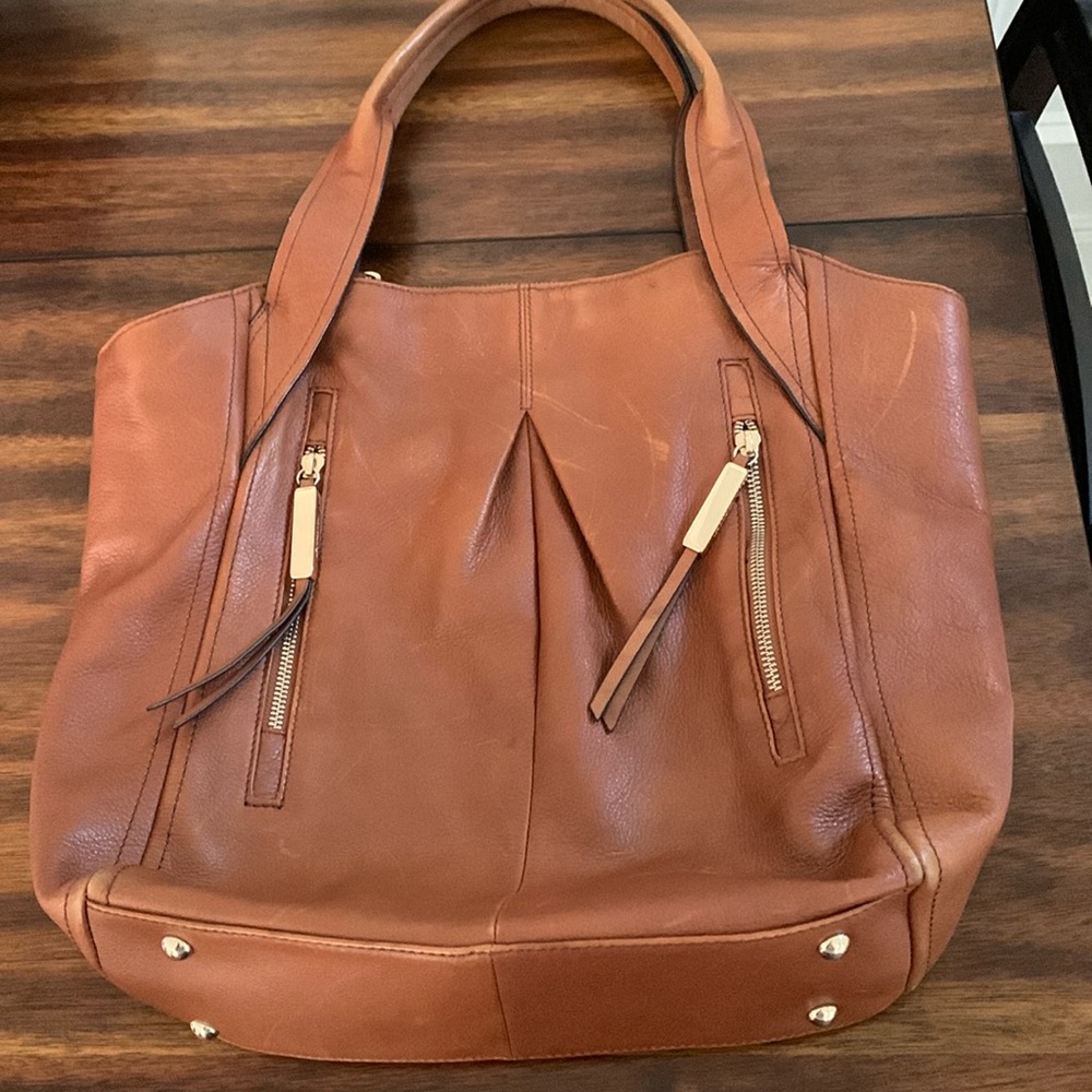 B Makowsky hobo bag in rich caramel. Gold hardware. Magnetic closure